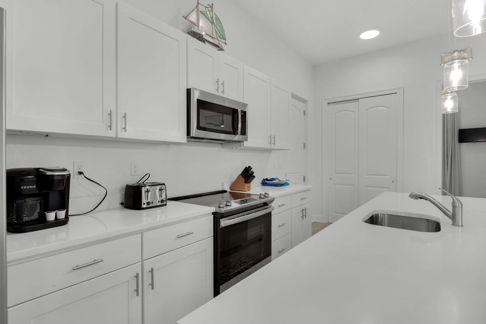 Fully equipped modern kitchen with stainless appliances