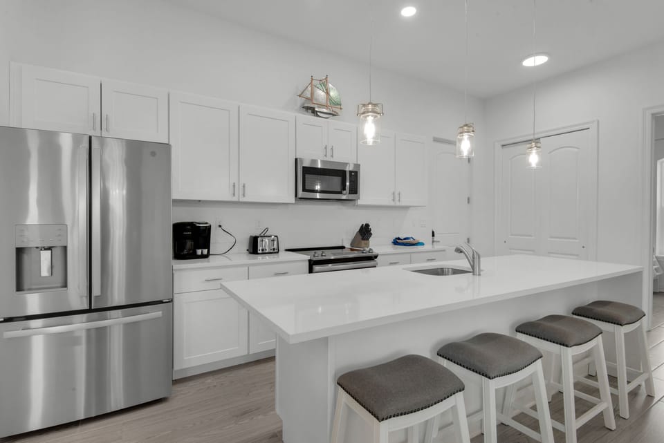Fully equipped modern kitchen with stainless appliances