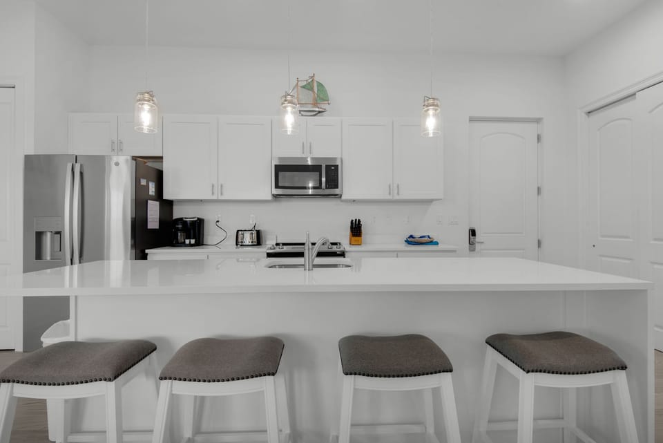 Fully equipped modern kitchen with stainless appliances
