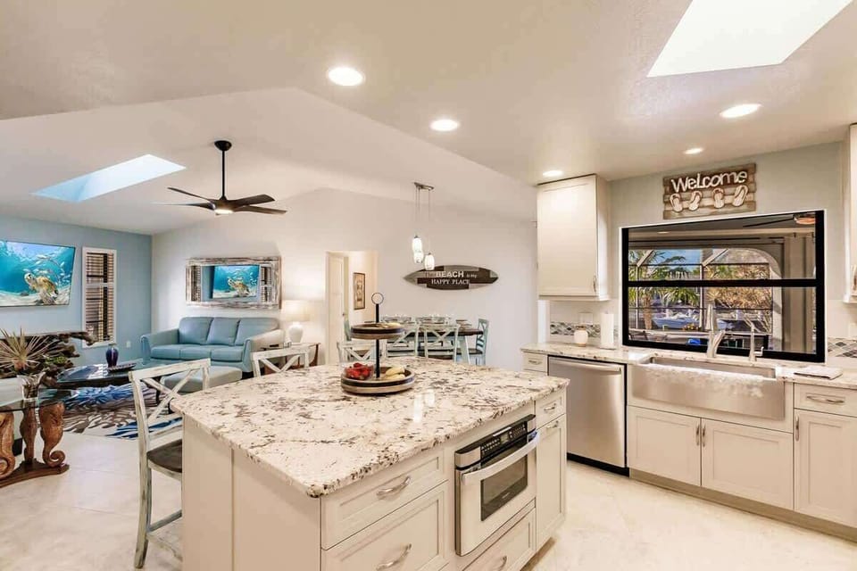 open concept kitchen with high end finishes and fully stocked