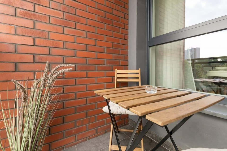Furnished balcony with dining area.