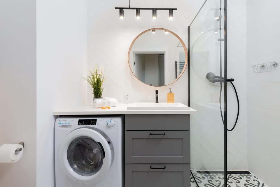 Bathroom with washing machine.