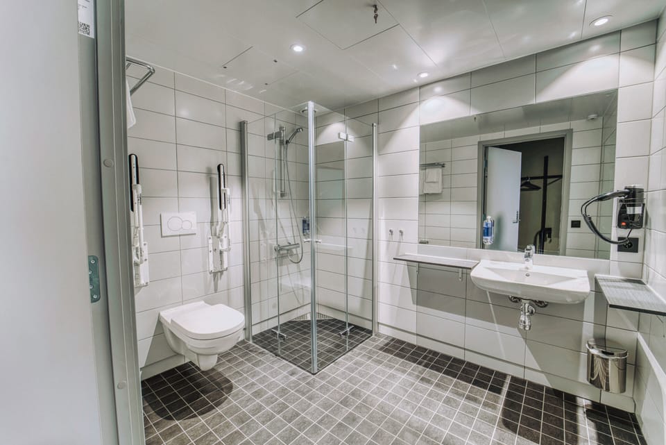 Shower, eco-friendly toiletries, hair dryer, towels