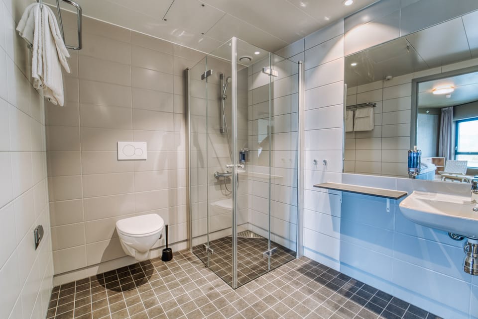 Shower, eco-friendly toiletries, hair dryer, towels
