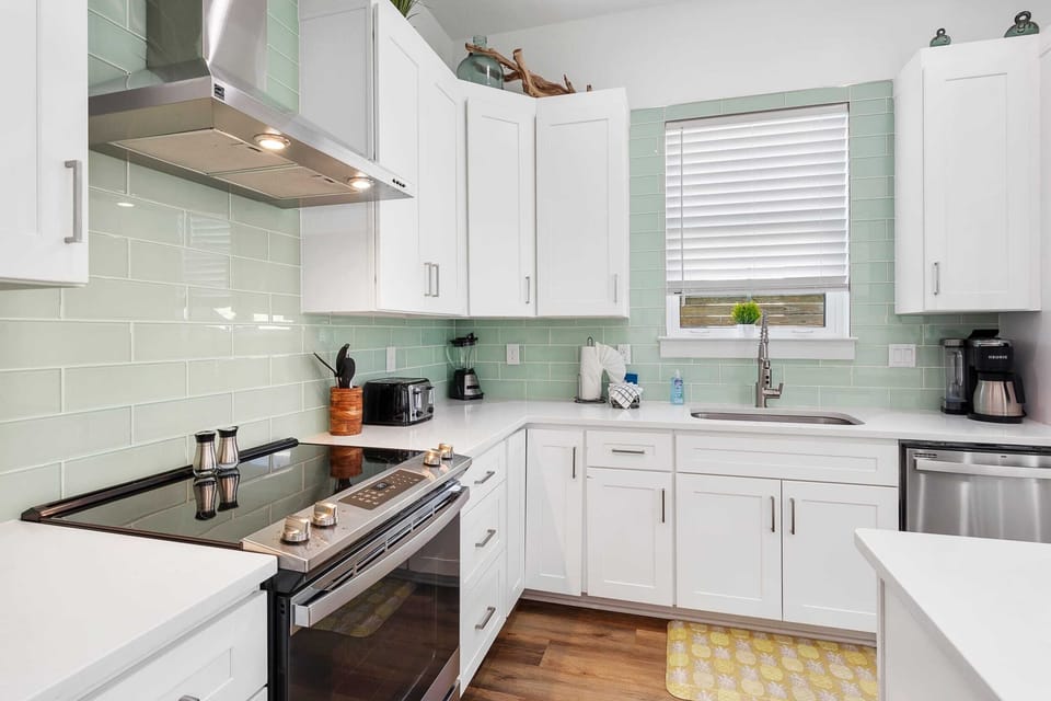 Modern coastal kitchen comes fully stocked.