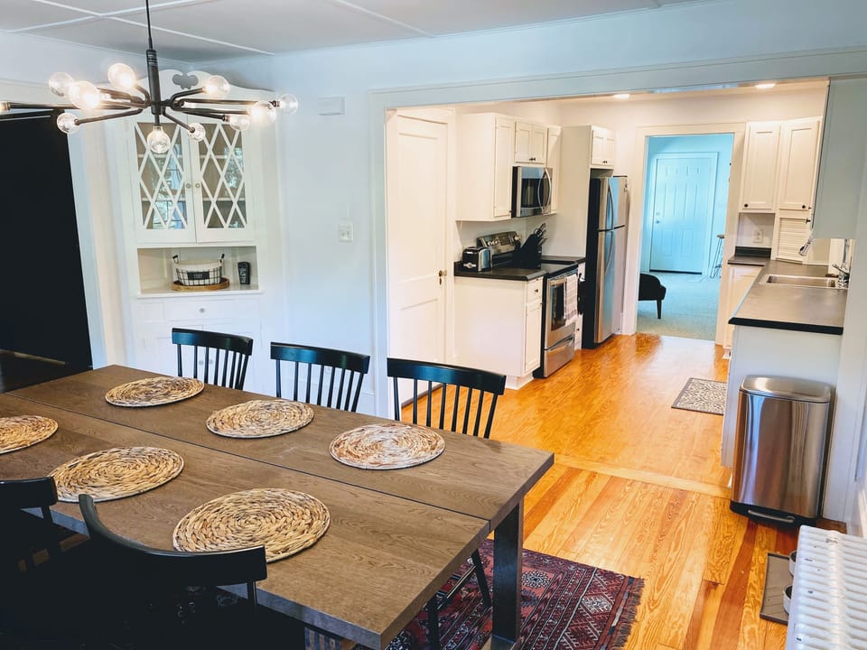 Dining room and fully-stocked kitchen