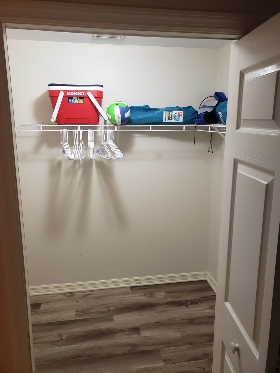 master closet with beach gear.