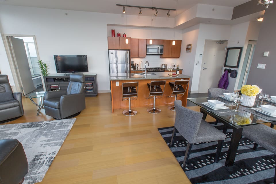 Kitchen amenities are unchanged. New kitchen cabinets, barstools, TV and couch.