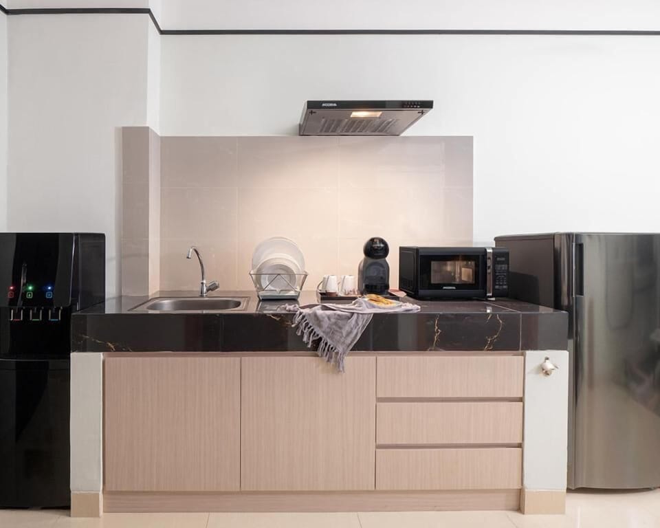 One Bedroom Suite | Private kitchen | Coffee/tea maker, fridge, microwave, dining table