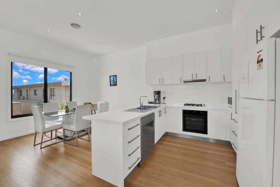 Sleek, modern kitchen with ocean views – perfect for your gourmet creations