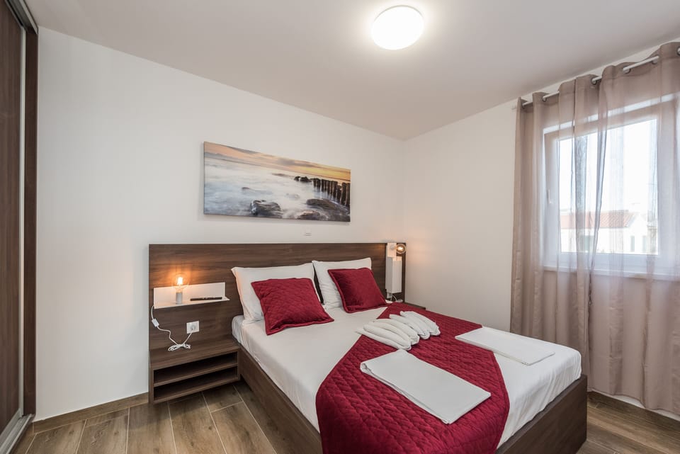 Deluxe Apartment, 2 Bedrooms, Balcony, Pool View | 2 bedrooms, in-room safe, iron/ironing board, free WiFi