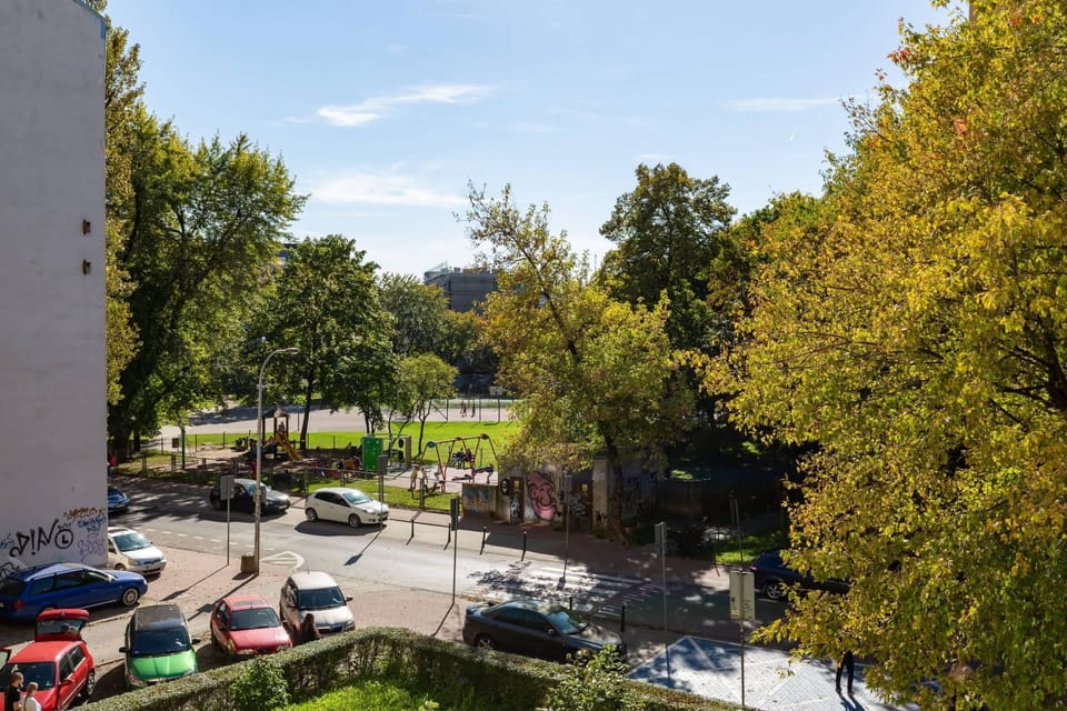 A scenic view from the apartment, overlooking a quiet and green residential area.
