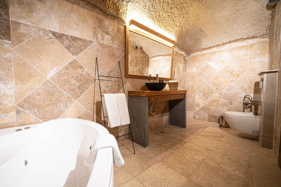 Traditional Suite, Jetted Tub | Bathroom | Free toiletries, hair dryer, slippers, towels