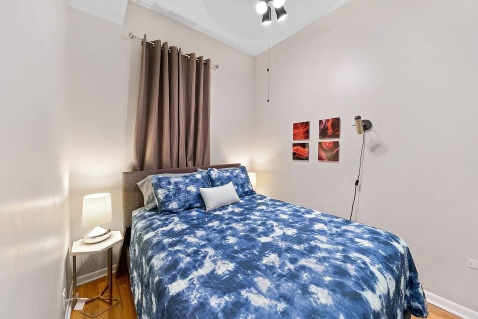 Primary Bedroom with queen sized bed and attached bathroom