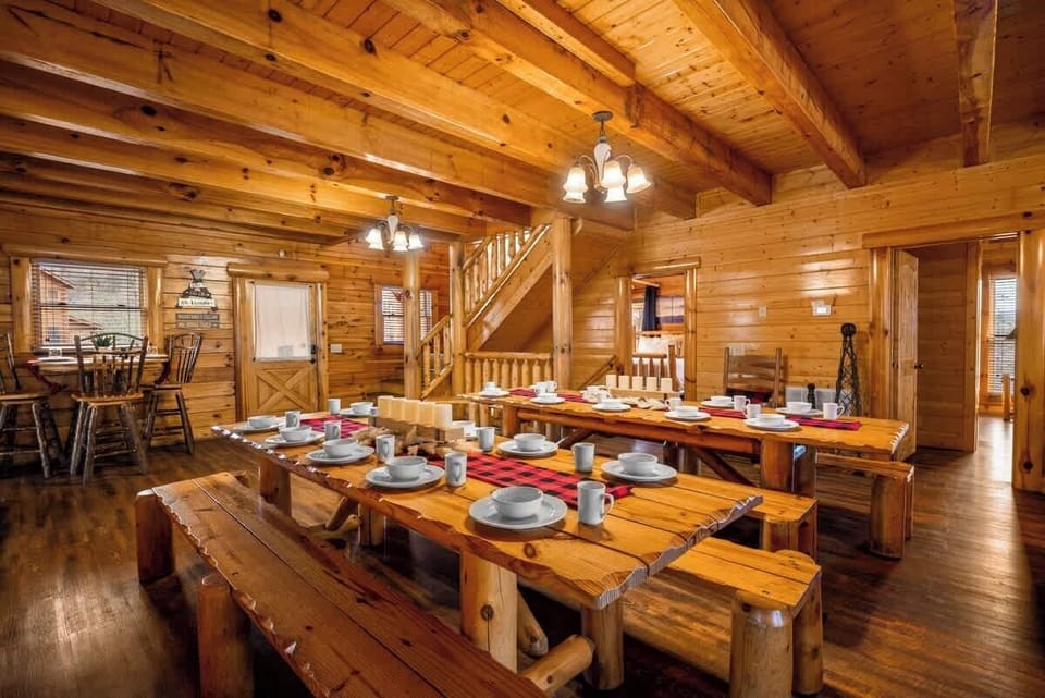 There are two huge picnic tables on the main level that can seat up to 24 adults. There is also a high top table that can seat 3 right by the kitchen. There is another dining table on the lower level with seating for 8.