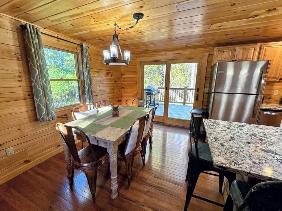 The fully equipped kitchen has stainless steel appliances and granite countertops.