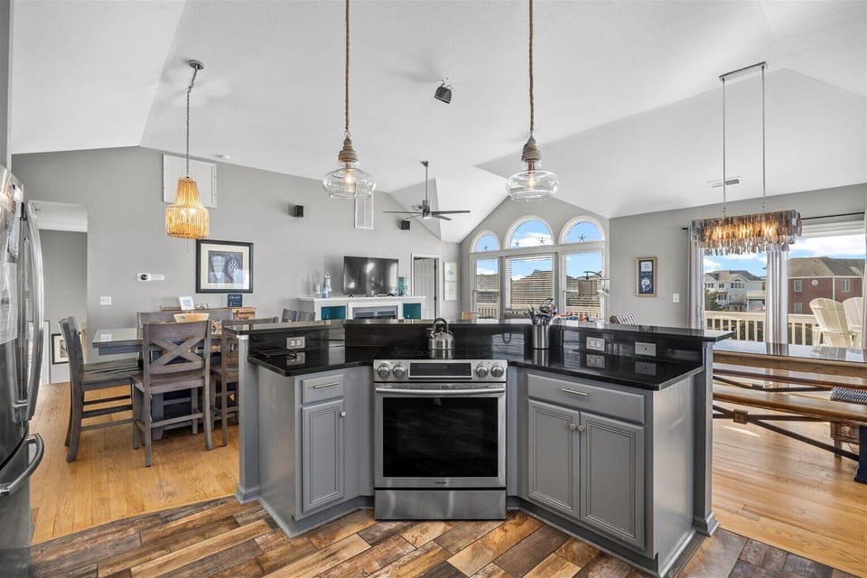 kitchen Island and table - Modern designs and stainless appliances make this kitchen an entertainer's dream.