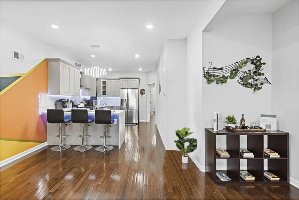 Discover a charming kitchen nook with a cozy table and comfortable high chairs. Enjoy quick meals and warm conversations in this intimate and inviting space.