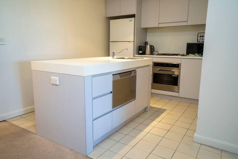 Open plan kitchen with full size fridge, oven and gas hob. Great kitchen Island for the budding chef and there are great take way options nearby to enjoy in the comfort of the property 