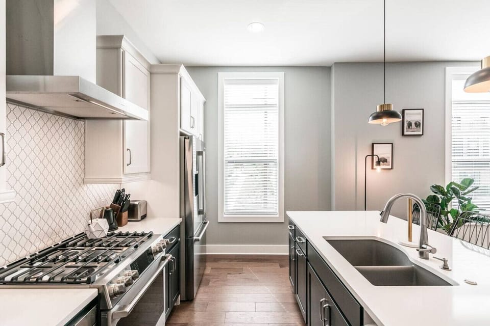 Amenities include gas range, side by side sink, & dishwasher.