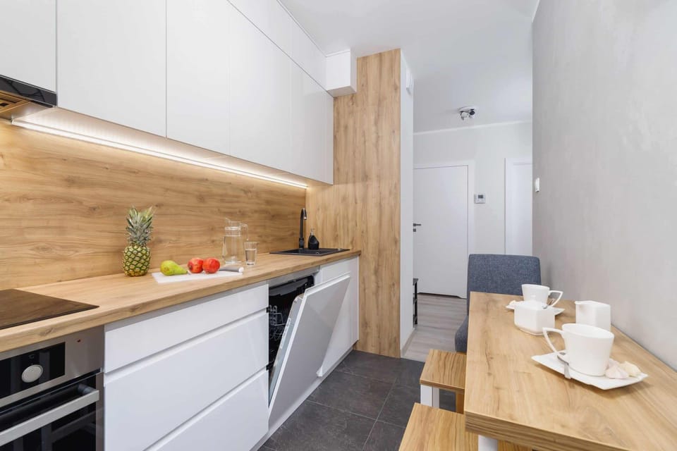Another angle of the kitchen showing a functional workspace and a sleek design.
