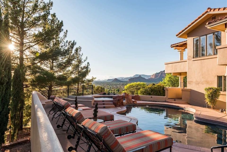 Plenty of lounge space by the pool that compliment the views