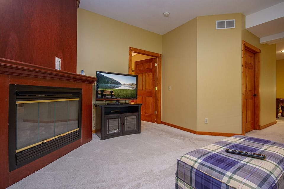 Lower-level living room with gas fireplace
