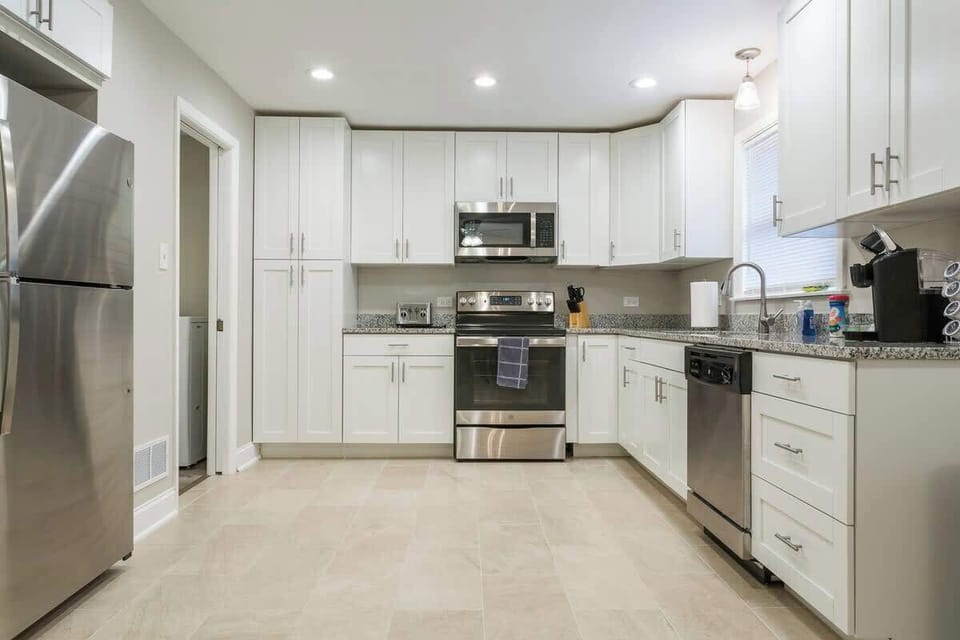 Kitchen area - glassware, dishware & silverware in the drawers and cabinets
