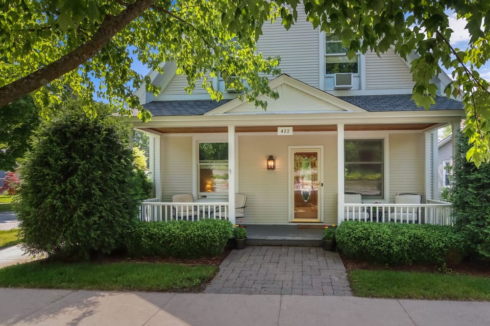 Charming front porch with chairs for coffee 