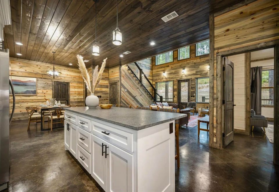 Step into our sunlit kitchen where functionality dances with elegance. It's the perfect spot to fuel up for your adventures or to chat over a glass of wine while dinner simmers.