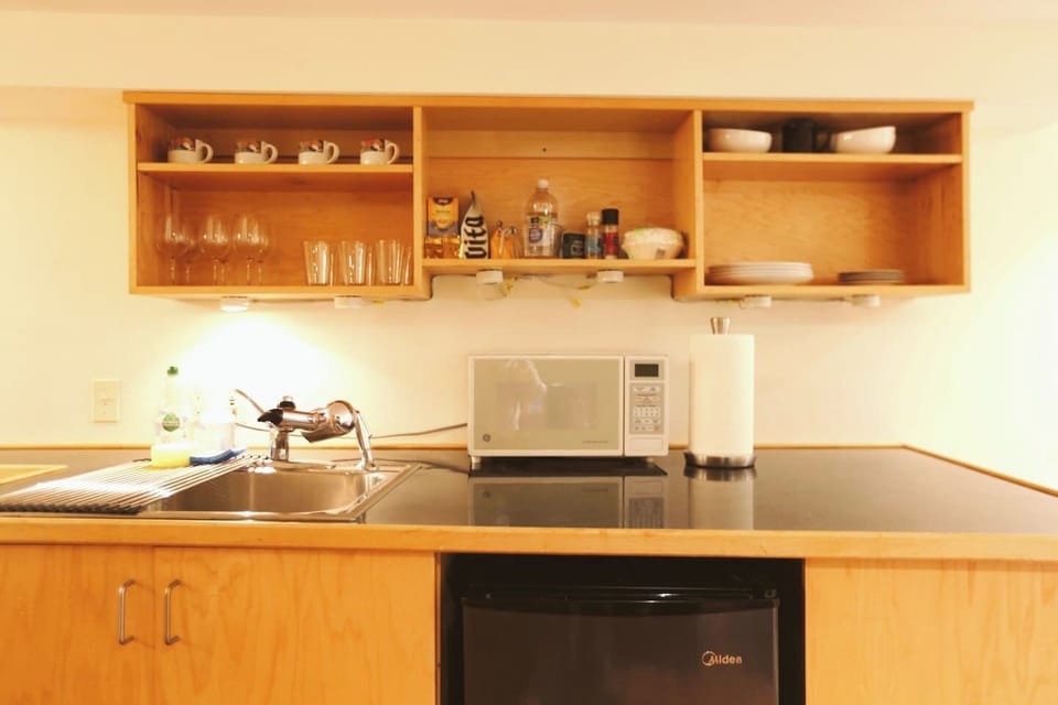 Kitchen amenities include
Coffee maker,  coffee, tea, electric kettle, toaster, microwave, refrigerator, portable stove cooktop and pots/pans