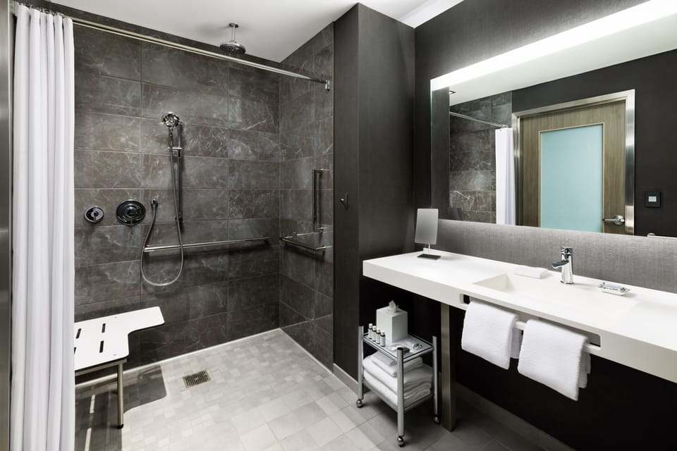 Rainfall showerhead, eco-friendly toiletries, hair dryer, towels