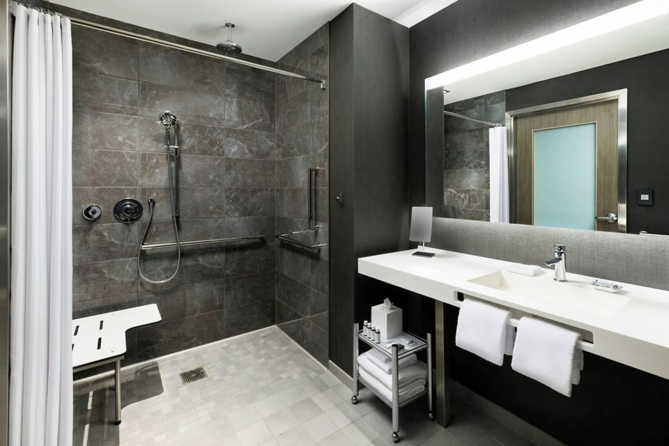 Rainfall showerhead, eco-friendly toiletries, hair dryer, towels
