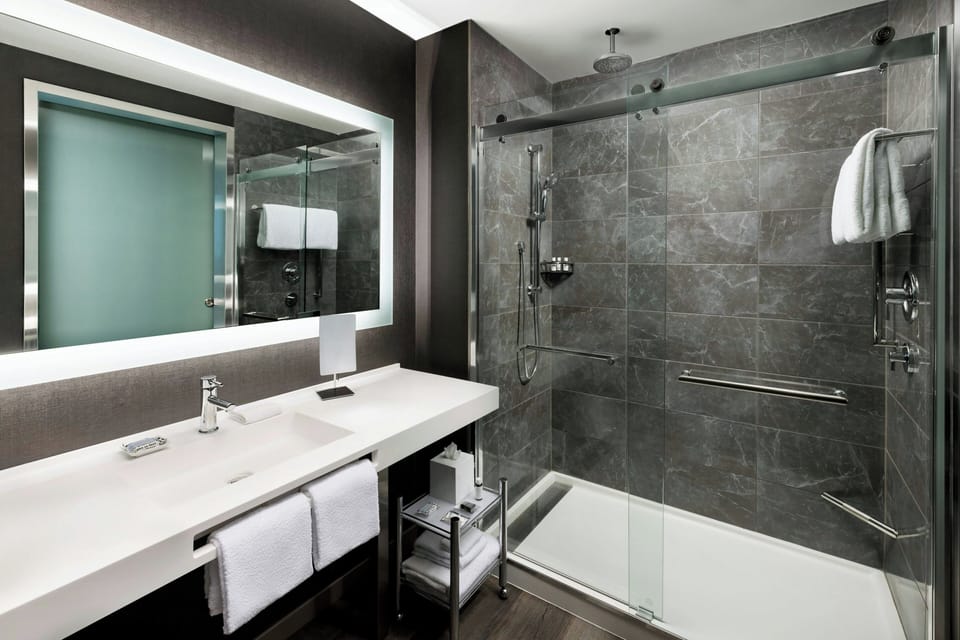 Rainfall showerhead, eco-friendly toiletries, hair dryer, towels