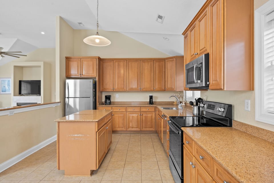 Kitchen - This kitchen is made for the family with more than on chef it's open concept offers plenty of counter space and natural light.