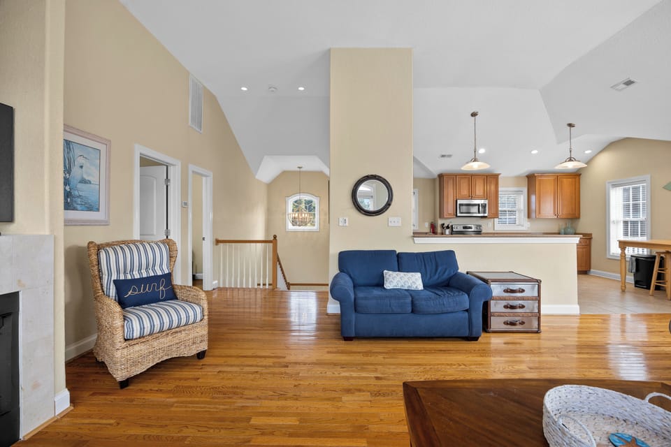 Livingroom - Located on the top level of the home, enjoy the hardwood floors, high ceilings and comfy sectional of the living room.
