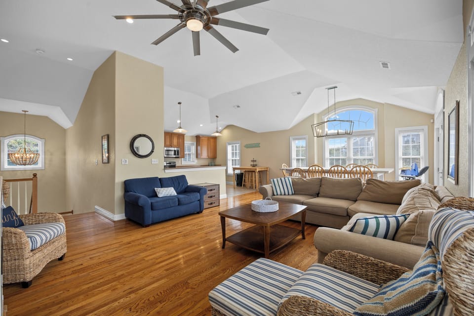 Livingroom - Located on the top level of the home, enjoy the hardwood floors, high ceilings and comfy sectional of the living room.
