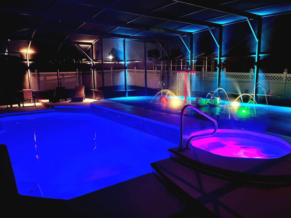 Pool, Hot Tub, and Splash Pad at Night