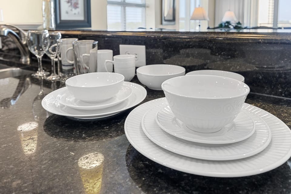 Sleek kitchen countertop with elegant dishware ready for use