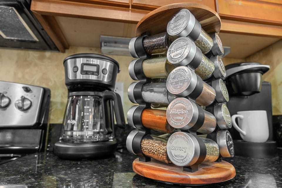 Organized kitchen spice rack and modern coffee station setup