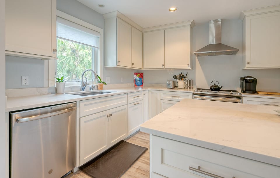 Spacious kitchen with stainless steel appliances.