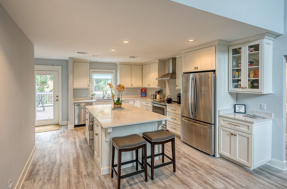 Spacious kitchen with stainless steel appliances.