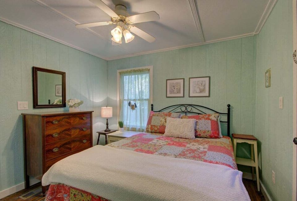 The second bedroom is cozy and elegant.