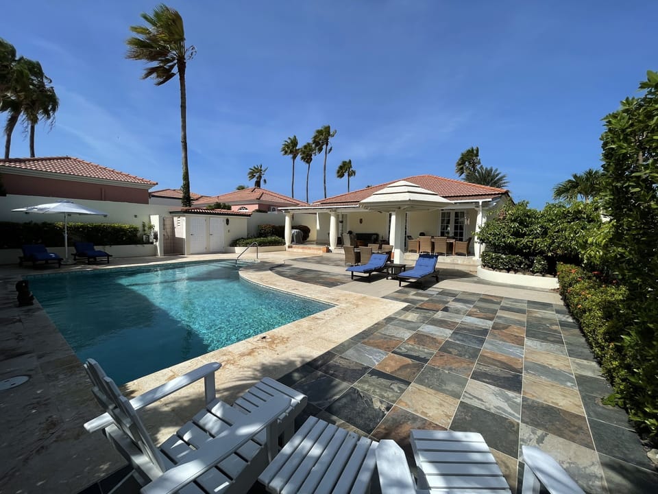 Pool area, outside bathroom and shower.   Lots of space to relax, umbrella 