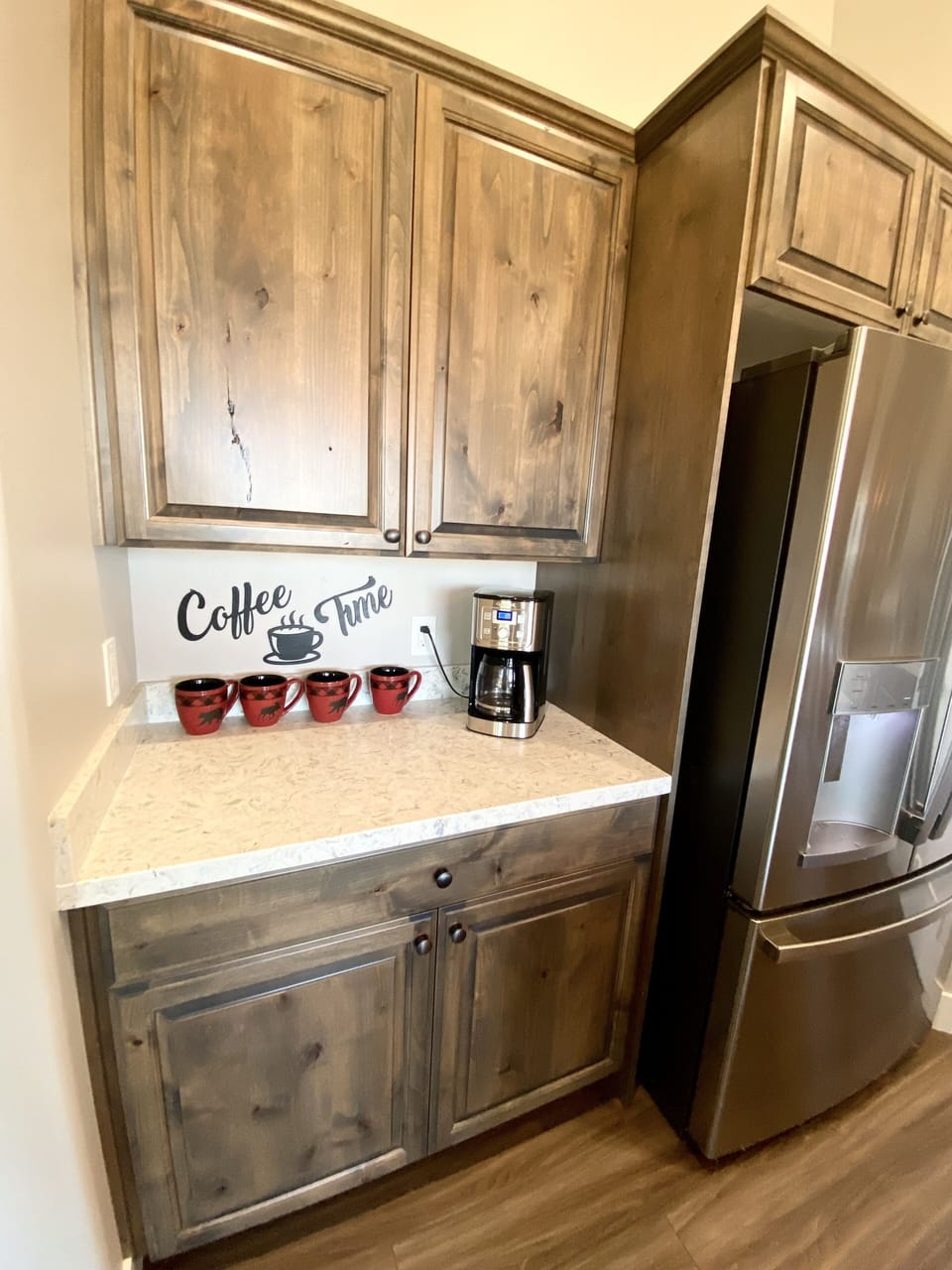 coffee station with GE Fridge that has ice/water feature.