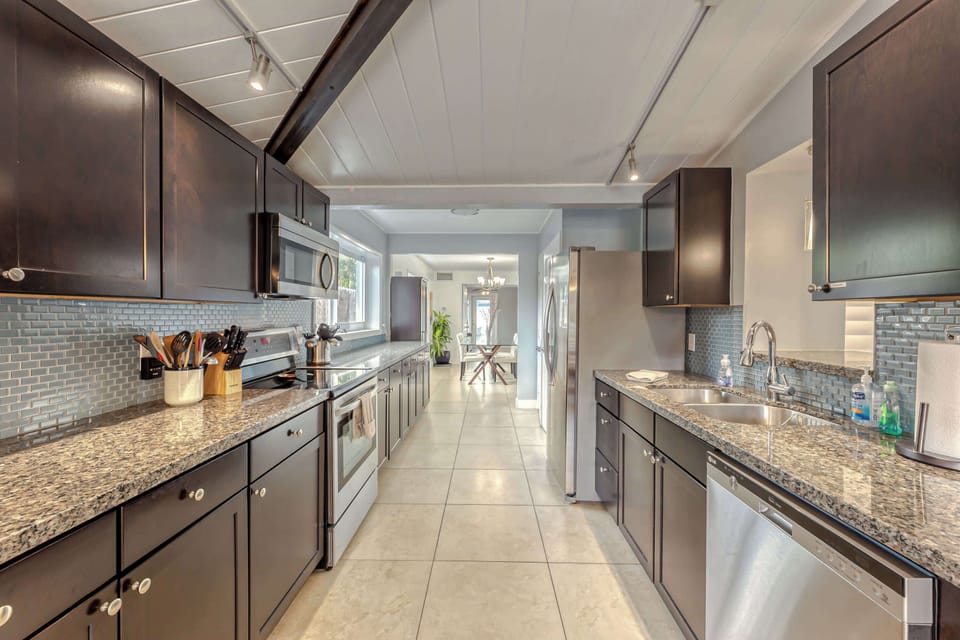 MAIN HOUSE KITCHEN #1- Fully Appointed Updated Kitchen with Stainless Steal Appliances (Microwave, Refrigerator, Ceramic Cooktop & Oven, Dishwasher, Toaster, Regular Drip Coffee Maker & Fully Stocked with Pots/Pans, Baking Pans, Dishware, Silverware 