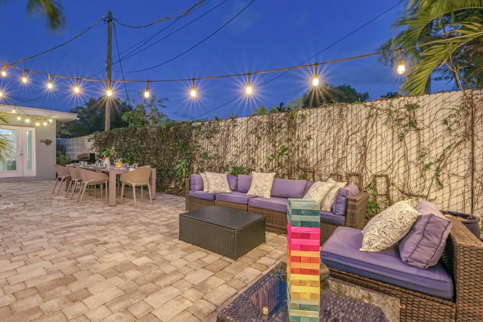 Spacious fenced-in back yard Oasis, heated pool, BBQ Grill, dining table for 10, lounge chairs, and patio table for lounging and entertaining. 