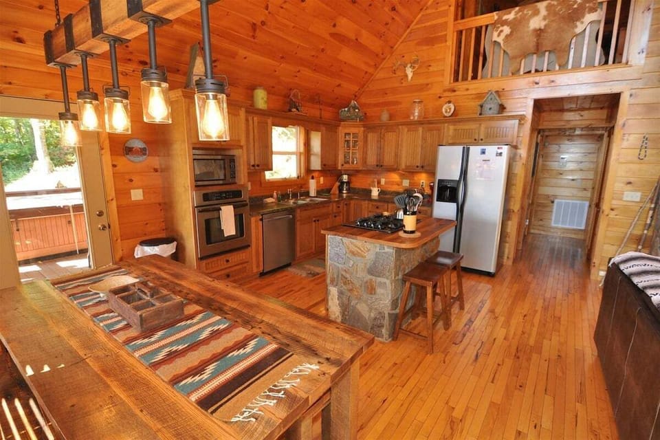 Fully equipped kitchen with stainless appliances at A Sunrise in the Smokies cabin near Bryson City