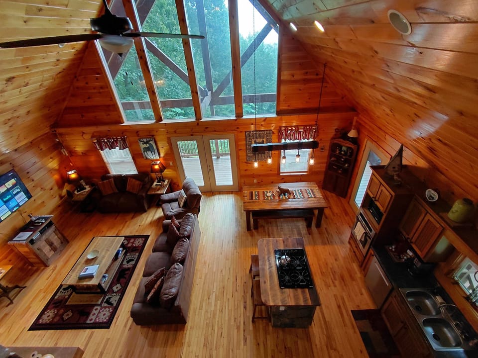 Massive picture windows flood the cabin with light and Smoky Mountain views.