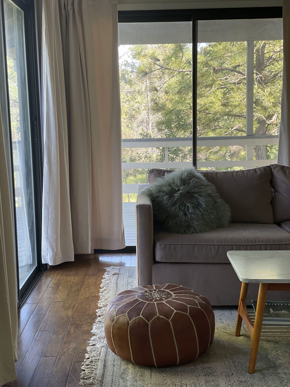 Living room leads to wraparound deck